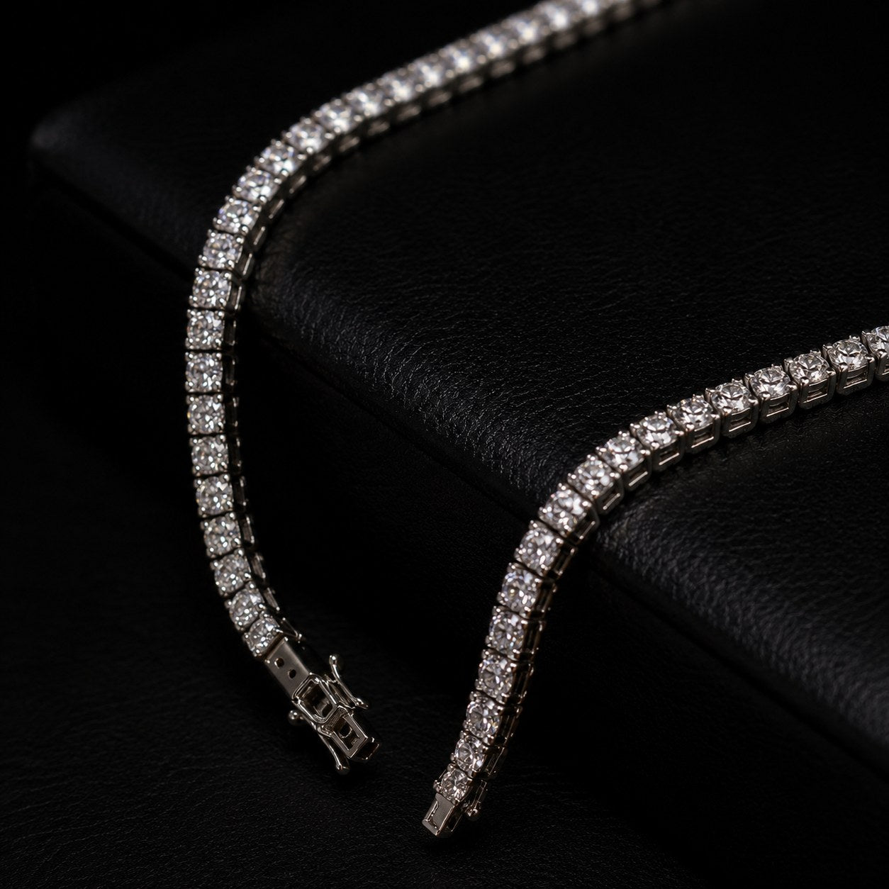Close up of diamond tennis chain clasp and stones